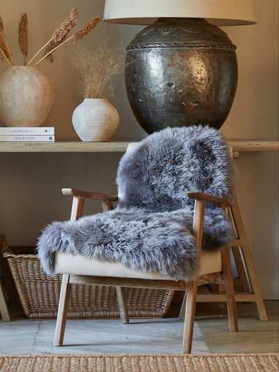 grey sheepskin rug on chair 